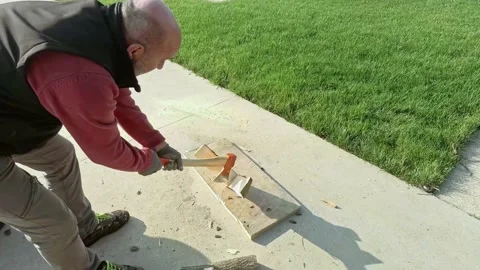 Close Up of Lumberjack Chopping Firewood Using Axe, Wooden at Garden Stock-Footage 144058220