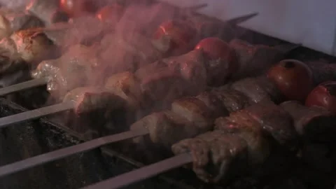 Close-up of lumpy kebab with tomato and ground kebab is grilled on the grill Stock Footage 204870673