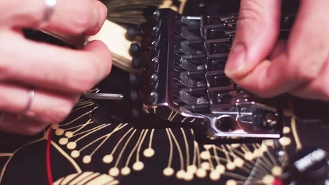 Close up of luthier changing guitar strings Stock-Footage 118013868