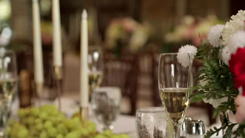 A close-up of a luxurious festive table in a restaurant for an event, with a Stock Footage 323636418