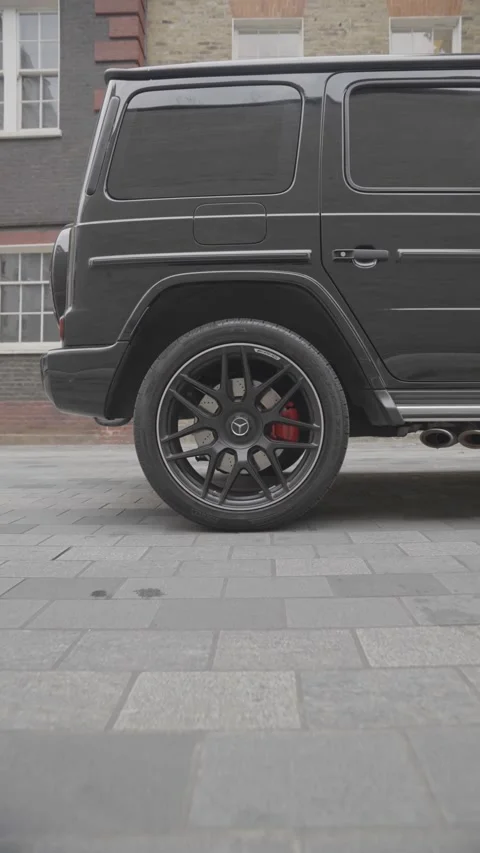 Close-Up of Luxury Car Back Wheel with Mercedes Branding raw footage Stock Footage 311437073