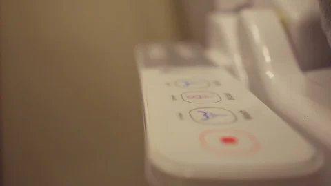 Close up luxury hot water bidet toilet controls 스톡 동영상 129790341