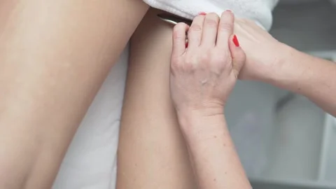 Close-up of lymphatic drainage massage of the legs Stock Footage 295351741
