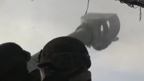 Close up of M777 Howitzer being fired and smoking gun Stock Footage 83162560