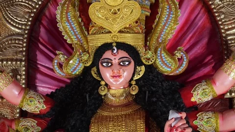 Close-up of Maa Durga idol face with golden crown and jewelry during Navrat.. Stock Footage 346729849