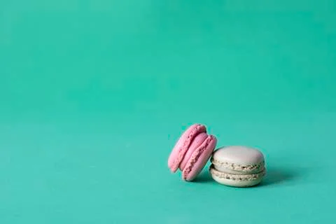 Close-Up Of Macaroons On green background Stock Photos
