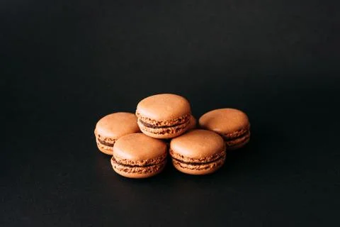 Close up of macaroons isolated on black background Stock Photos
