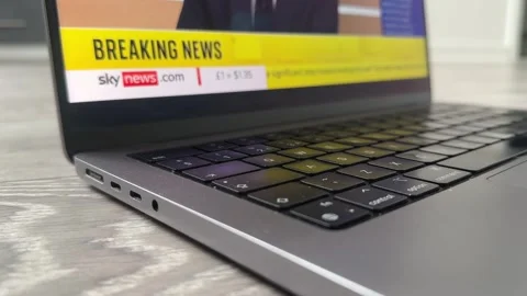 Close-Up of MacBook Laptop Streaming Sky News Live Breaking News Channel Stock Footage 315656165