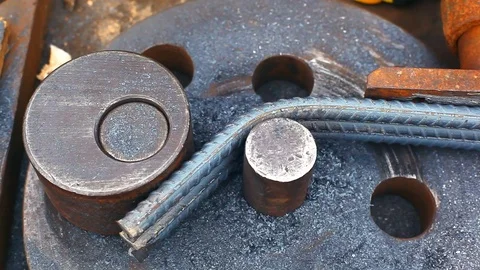 Close-up of machine bending steel bars Stock Footage 103086836