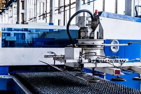 Close up of machine for loading sheet metal in factory 写真素材