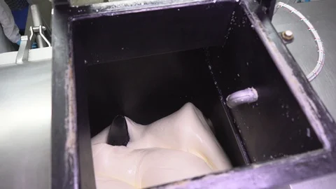 Close-up of the machine making cheese in factory Stock Footage 129928184