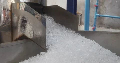Close up of a machine making small cube ice for coffee only 動画素材 240386351