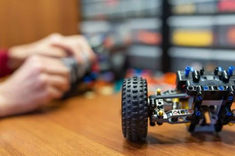 Close up of a machine toy part made of engineering constructor on the table Foto stock