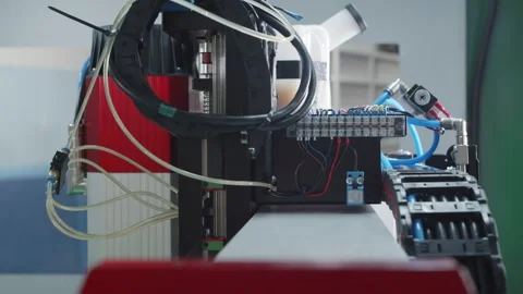 A Close Up of a Machine with Wires Attached to It: The Production of Parts on a Stock Footage 254974489
