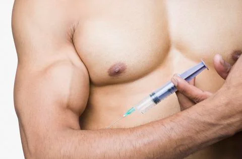 Close-up of a macho man taking steroids Fotos Stock