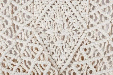 Close up of Macrame wall hanging pattern a form of textile produced using Stock Photos