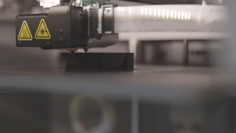 Close up macro of 3D printer printing a plastic part slider with shallow Stock Footage 139604947