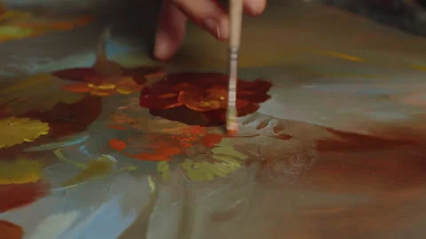 Close-up, macro, the artist's hand with a brush and oil paints draws a bouquet Stock Footage 230989034