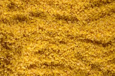 Close-up macro background of raw bulgur wheat grains Stock Photos