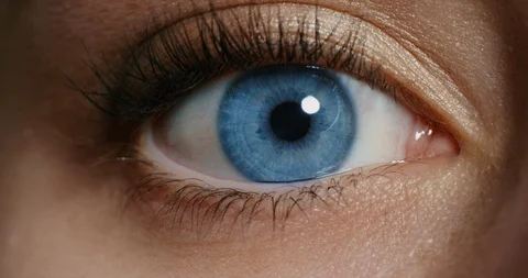 Close up macro blue eye opening human iris natural beauty Stock Footage 96945219