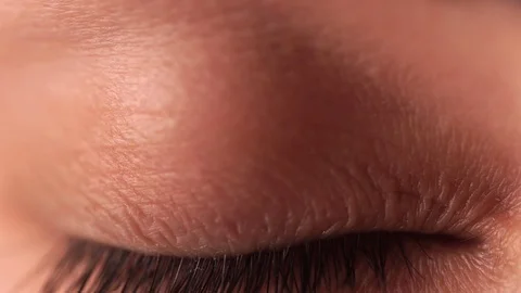 Close up macro blue eye opening beautiful iris natural human beauty healthy Stock Footage 129848511