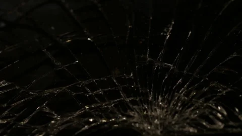 Close-up macro of broken dark glass. Elements of smartphone, screen, hammer blow Stock Footage 97883355
