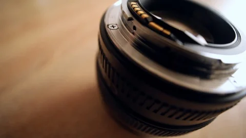 Close up macro of camera lens with sun light on blurred background. Detail 스톡 동영상 126768900