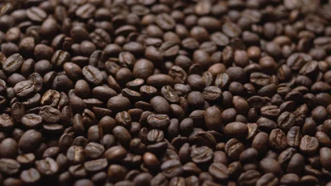 Close up macro coffee beans detailed roasted grains texture bokeh Stock Footage 239102176
