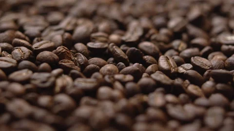 Close up macro coffee beans detailed roasted grains texture bokeh Stock Footage 239102287