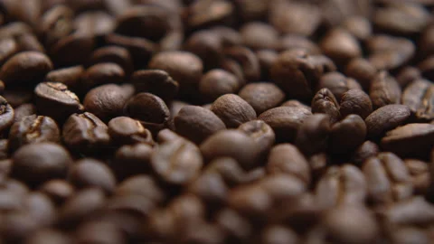 Close up macro coffee beans detailed roasted grains texture bokeh Stock Footage 239111393