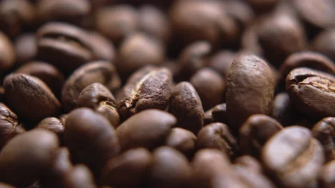 Close up macro coffee beans detailed roasted grains texture bokeh Stock Footage 239111688