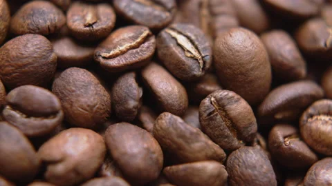 Close up macro coffee beans detailed roasted grains texture bokeh Stock Footage 239116124