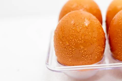 Close up macro at Cold brown Eggs with droplet on white background. Foto stock