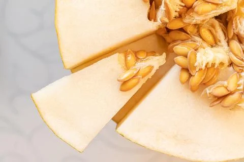 Close up macro of the cut melon with seeds to get some vitamin Foto stock