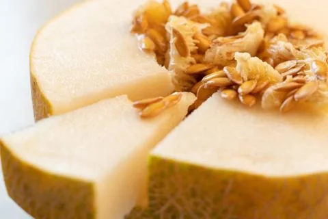Close up macro of the cut melon with seeds to get some vitamin Stock Photos