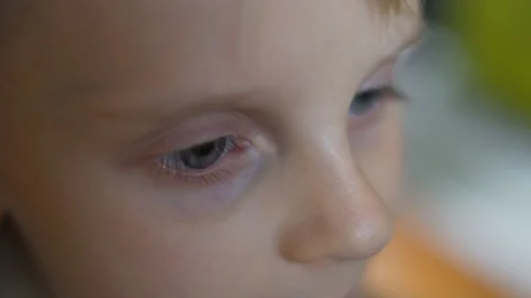 Close-up macro of the face of a small blond light-skinned child, eyes, nose, eye Stock-Footage 118960058
