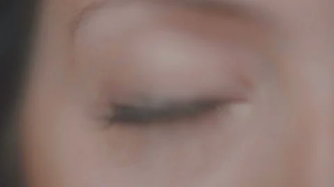 Close-up macro of female eye in slow motion Stock Footage 100895429