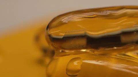 Close-up macro fish oil flows down the gelatin capsules omega 3 fish oil pills Stock Footage 263141870