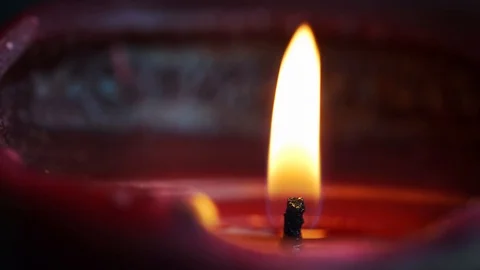 Close up macro footage of a candle flame burning in 4K Vídeo Stock 123021064