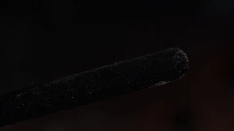 Close up macro footage of an incense stick being lit and burning Video stock 123021168