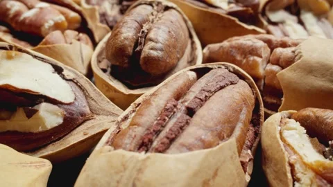 Close-up macro footage of pecans rotates. Macro shot. Pecan background. Stock Footage 290114534