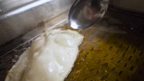 Close-up macro frying chebureks in hot oil. Stock Footage 190577290