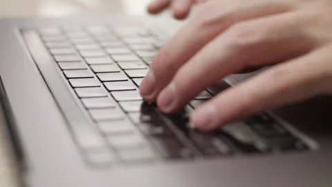 Close up macro of hands typing on laptop keyboard computer Stock Footage 274293599