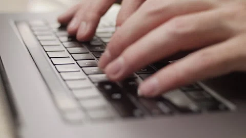 Close up macro of hands typing on laptop keyboard computer Stock Footage 274293679