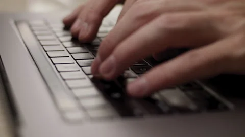 Close up macro of hands typing on laptop keyboard computer Stock Footage 274294461