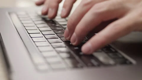 Close up macro of hands typing on laptop keyboard computer Stock Footage 274294563