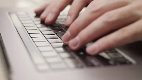 Close up macro of hands typing on laptop keyboard computer Vidéo 274295326