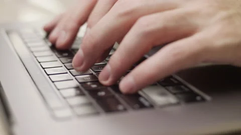 Close up macro of hands typing on laptop keyboard computer Stock Footage 274295888