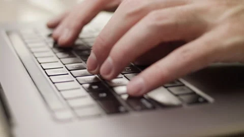Close up macro of hands typing on laptop keyboard computer Stock Footage 274295971