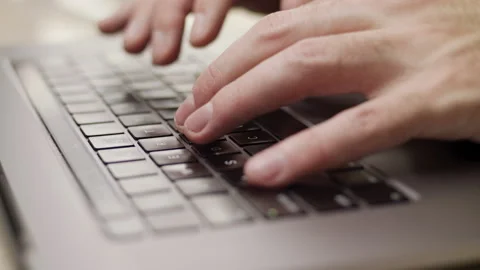 Close up macro of hands typing on laptop keyboard computer Stock Footage 274295987